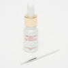 Aragan Secret nail treatment bottle with a dropper on a white background